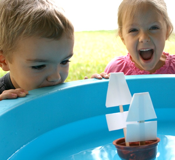 Mini Mayflower boats made from applesauce cups floating in water