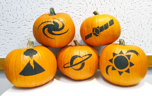 Space themed pumpkins with galaxy, sun, Saturn, volcano and spacecraft designs
