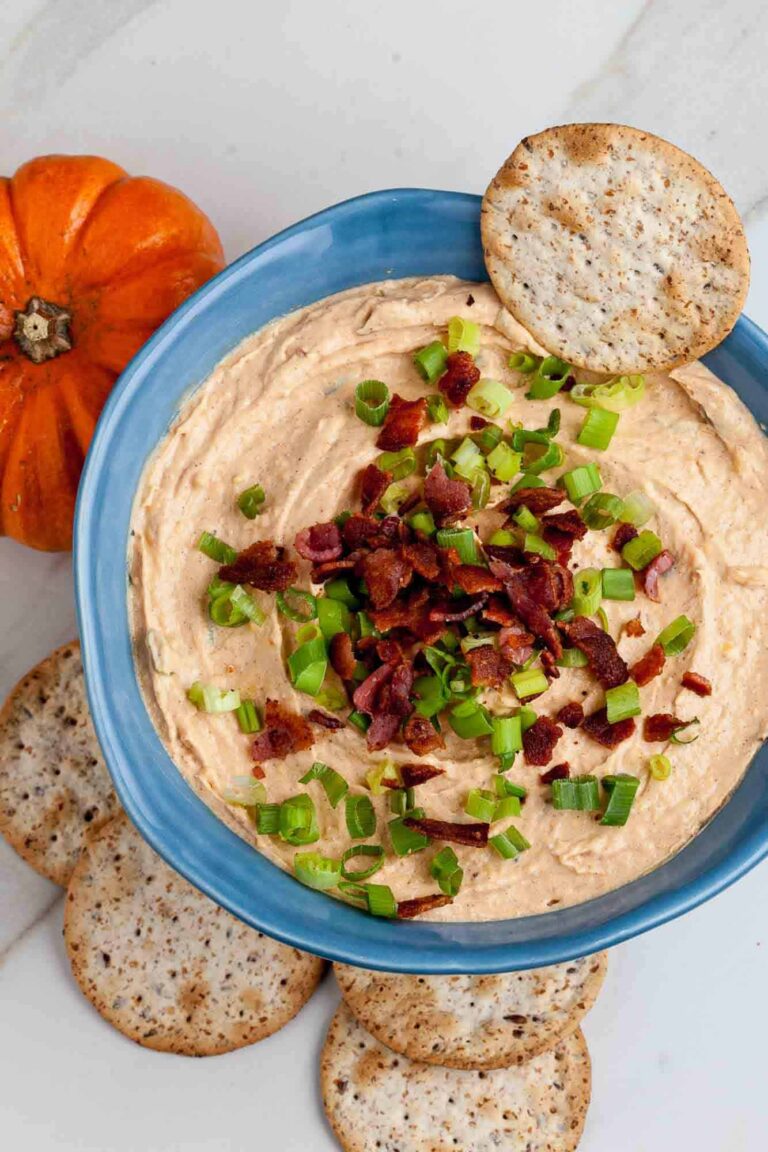 Savory pumpkin dip topped with bacon and pepitas