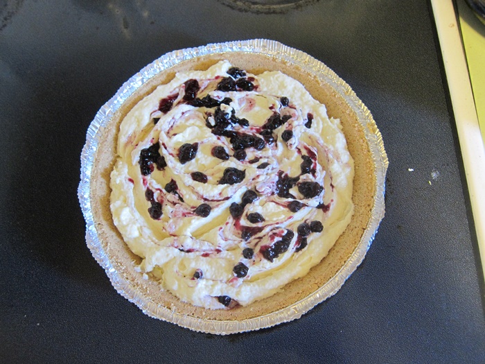 No-bake spaghetti squash cheesecake in a graham cracker crust with a blueberry jam swirl