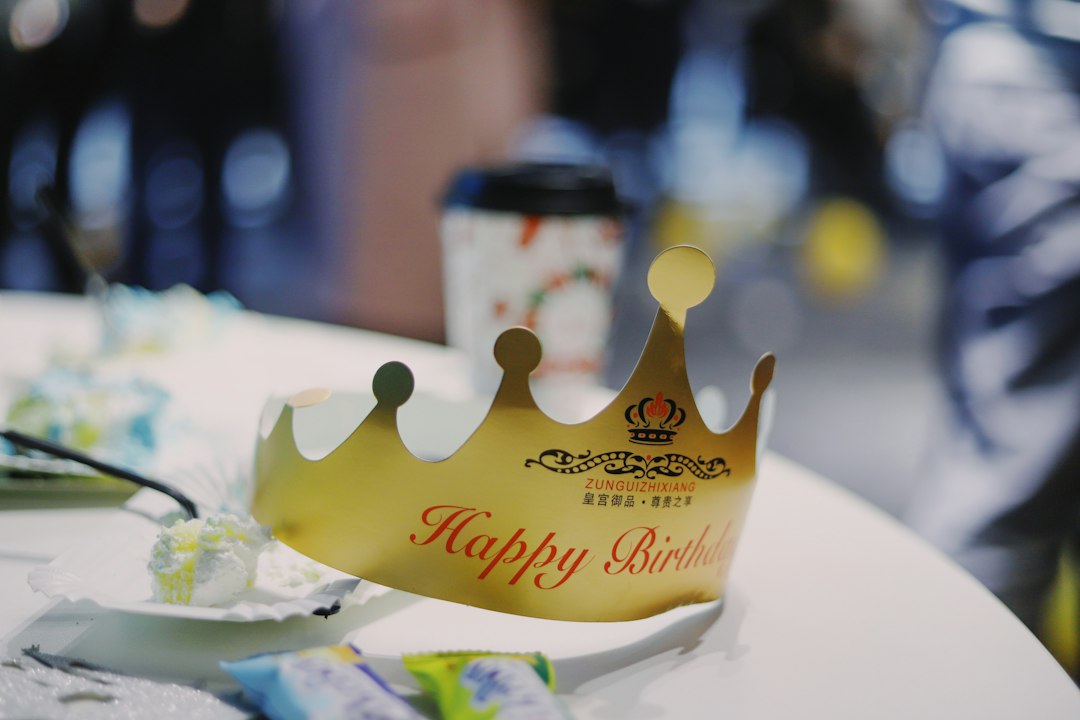 Gold paper Happy Birthday crown on a party table