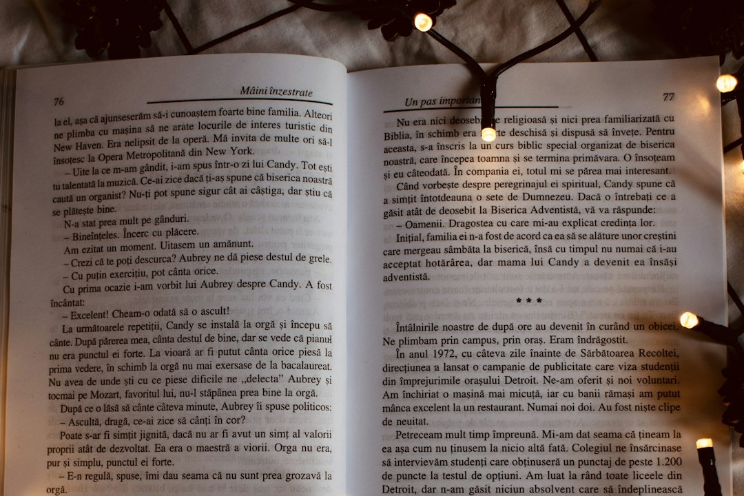 Open book surrounded by a string of warm twinkle lights