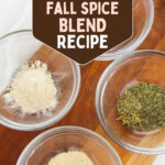 Overhead view of small glass bowls of garlic powder, onion powder and dried thyme on a wooden board. Text reads Copycat HelloFresh Fall Spice Blend Recipe.